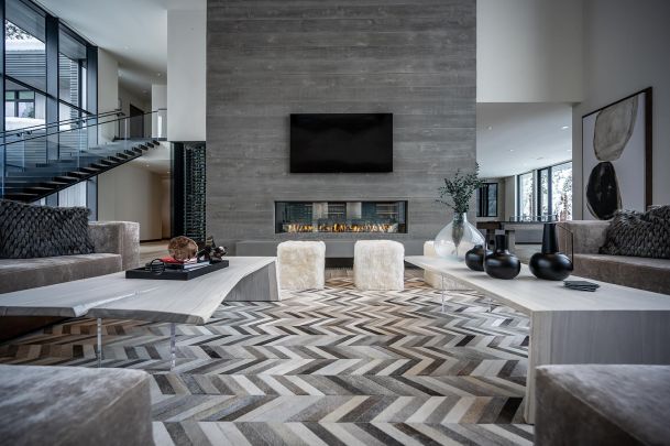 Modern living room with white walls and an accent grey wall with a TV front view